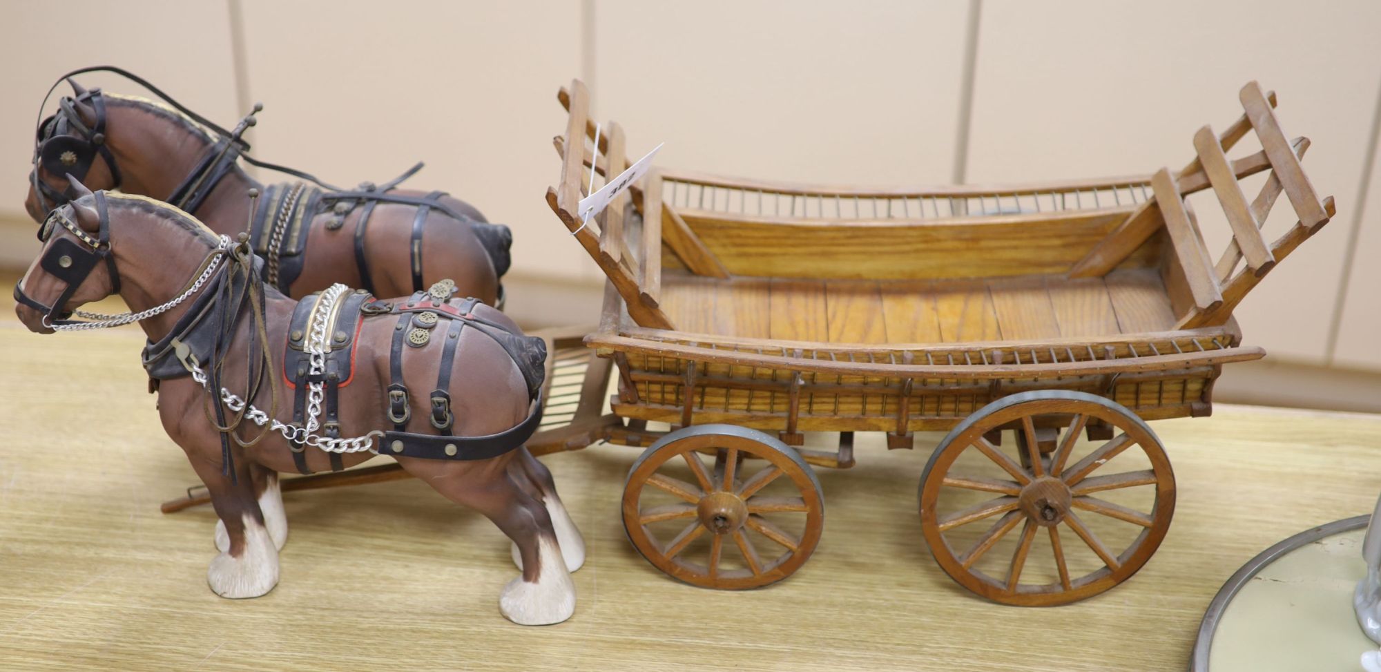 Two Beswick matt models of Burnham beauty with harnesses, length 32cm, and a scratch built model cart, length 70cm approx.